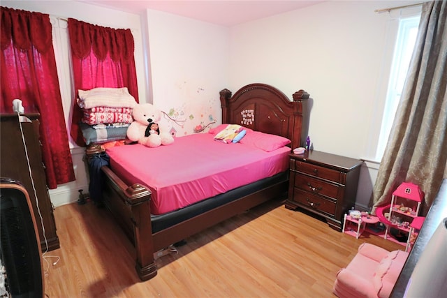 bedroom featuring wood-type flooring