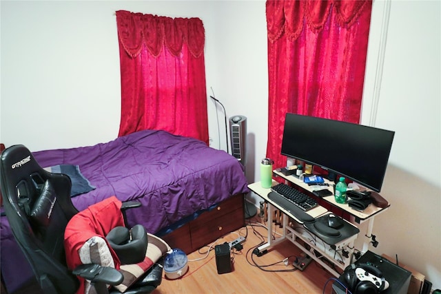 bedroom with wood-type flooring