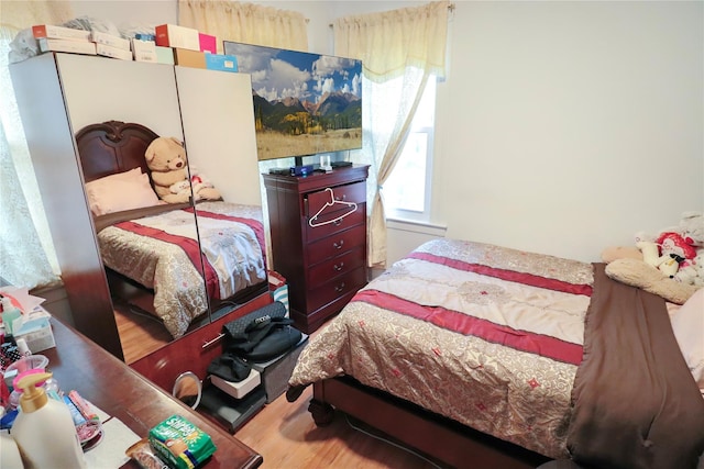 bedroom with light hardwood / wood-style floors