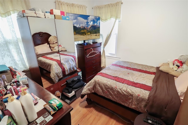 bedroom with light hardwood / wood-style floors