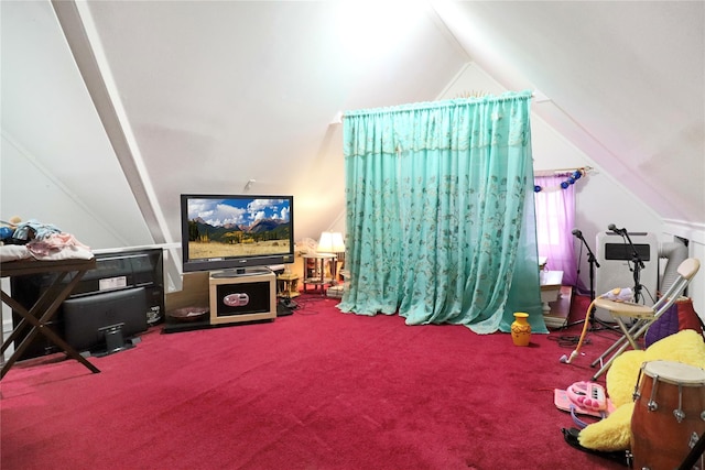 recreation room with lofted ceiling and carpet flooring