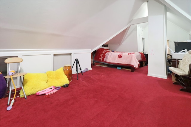 bedroom with lofted ceiling and carpet flooring