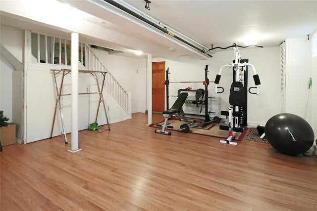 exercise room featuring light hardwood / wood-style flooring