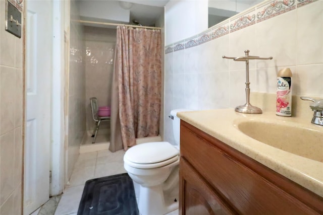 bathroom with tile patterned flooring, vanity, tile walls, toilet, and a shower with shower curtain