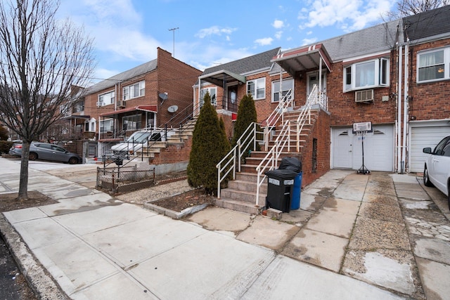 townhome / multi-family property featuring a garage