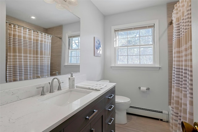 full bathroom featuring toilet, vanity, shower / bathtub combination with curtain, and baseboard heating