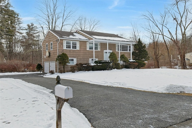 raised ranch featuring a garage