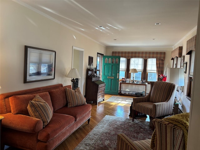 living room featuring hardwood / wood-style flooring and ornamental molding