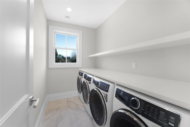 laundry room with washer and dryer