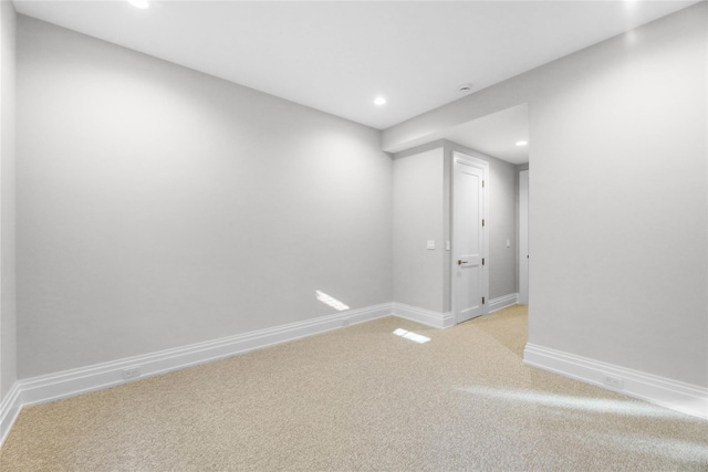 spare room with light carpet