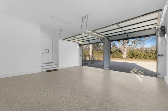 garage featuring a carport