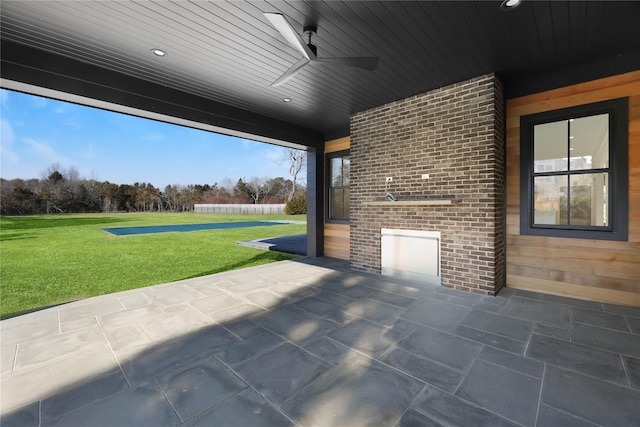 view of patio featuring ceiling fan