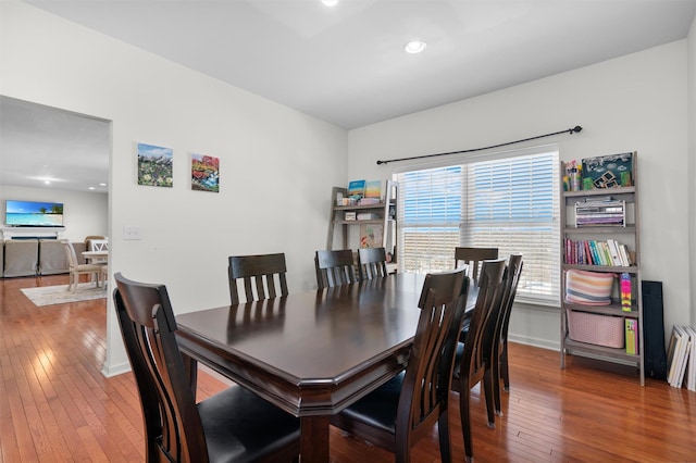 dining space featuring wood-type flooring