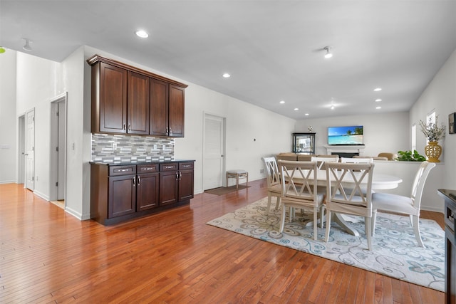 dining area with hardwood / wood-style flooring