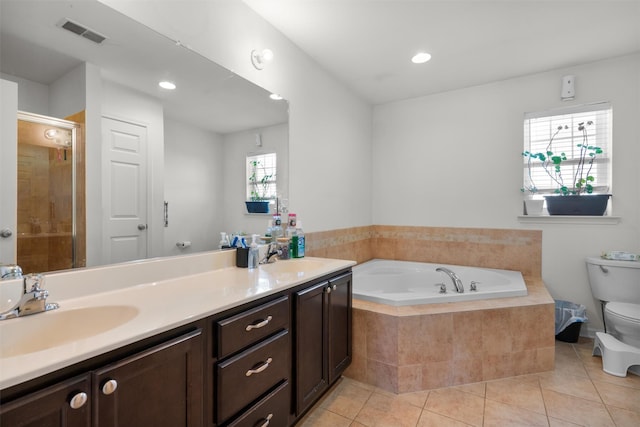 full bathroom with tile patterned floors, vanity, toilet, and separate shower and tub