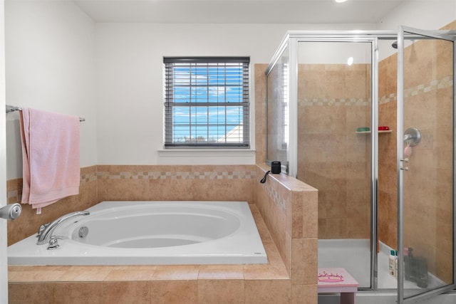 bathroom with shower with separate bathtub