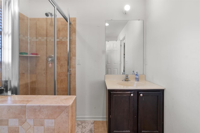 bathroom featuring an enclosed shower, vanity, and tile patterned flooring