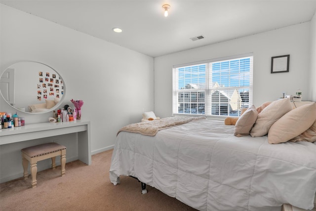 bedroom with light colored carpet