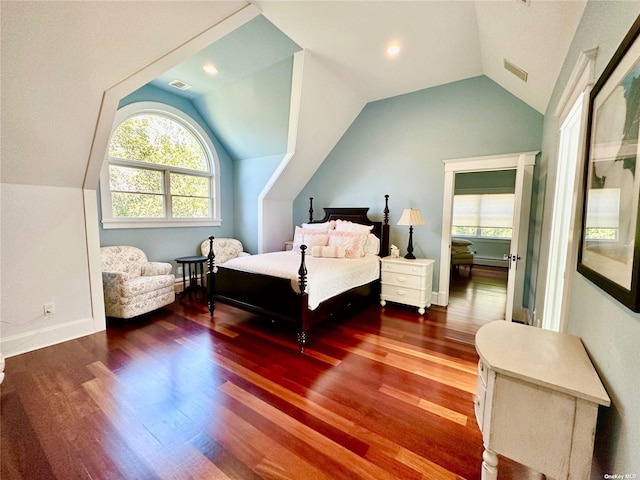 bedroom featuring wood-type flooring and lofted ceiling