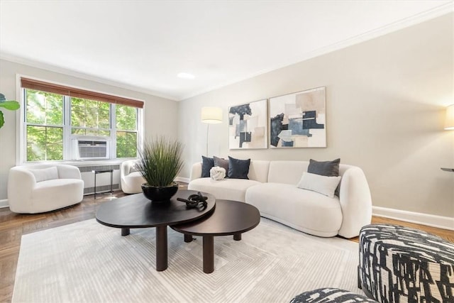 living room featuring radiator, ornamental molding, and parquet floors