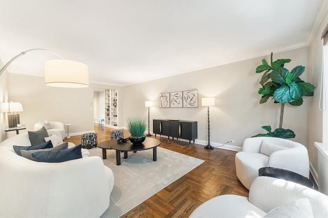 living room with dark parquet floors and ornamental molding