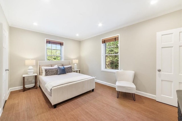 bedroom featuring light colored carpet and crown molding