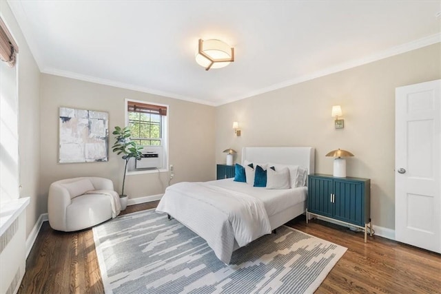 bedroom featuring radiator, dark hardwood / wood-style flooring, and crown molding