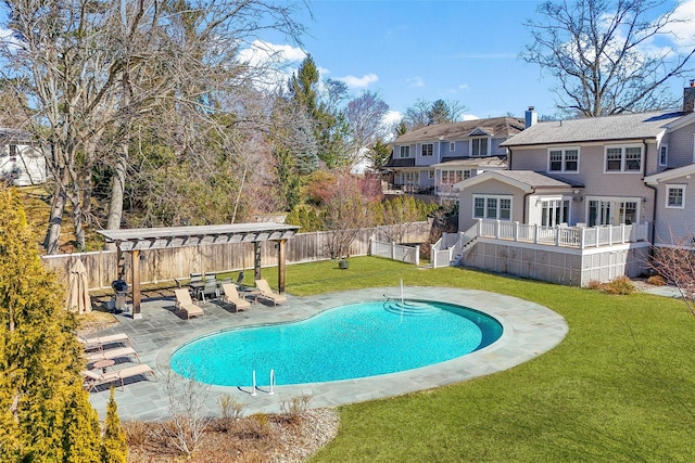 view of swimming pool with a patio, a lawn, a pergola, and a fenced backyard