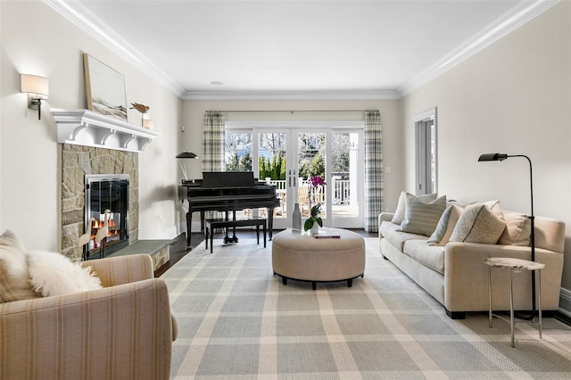 living room with light carpet, a stone fireplace, french doors, and crown molding