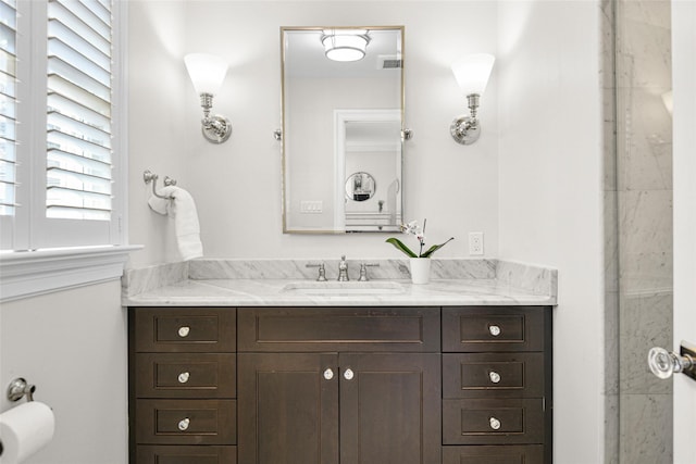 bathroom with visible vents and vanity