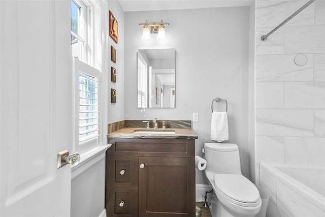 full bath with toilet, vanity, and washtub / shower combination