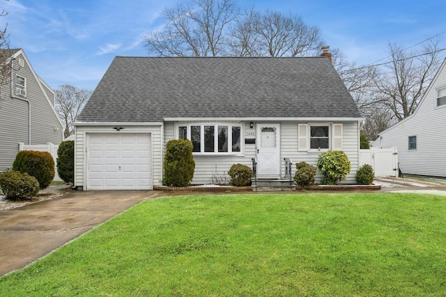 view of front of house with a garage and a front lawn