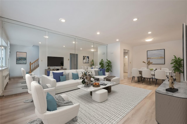 living room with light hardwood / wood-style flooring