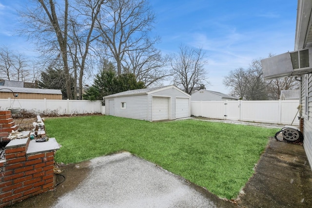 view of yard with a garage and an outdoor structure