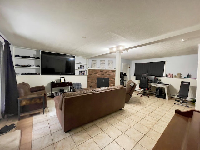 living room featuring light tile patterned flooring and a textured ceiling