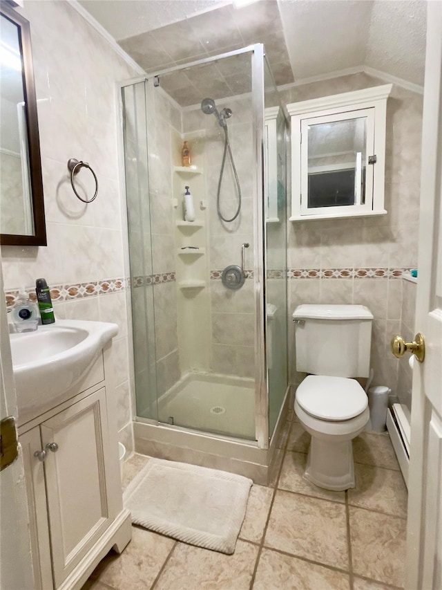 bathroom featuring a shower with door, a baseboard radiator, tile walls, vaulted ceiling, and ornamental molding