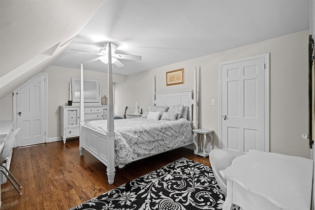 bedroom with dark wood-type flooring, ceiling fan, and lofted ceiling