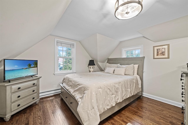 bedroom with a baseboard heating unit, dark hardwood / wood-style floors, and vaulted ceiling