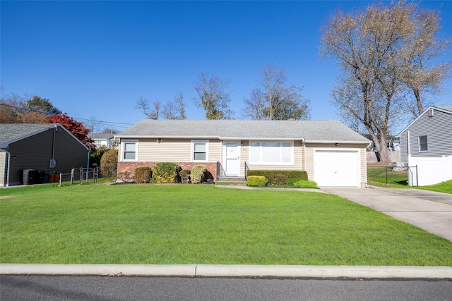 single story home featuring a garage and a front yard