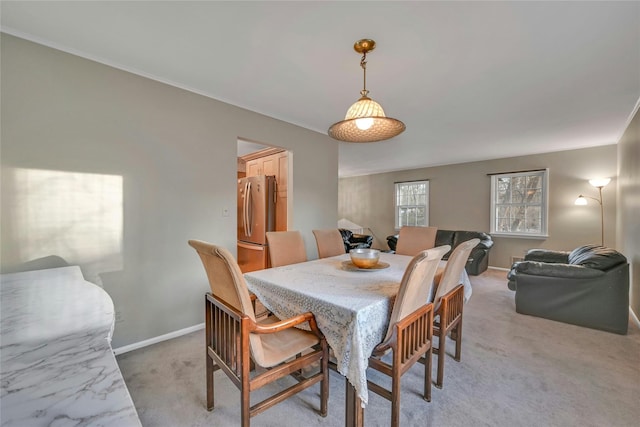 view of carpeted dining space