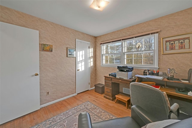 office space with light hardwood / wood-style flooring