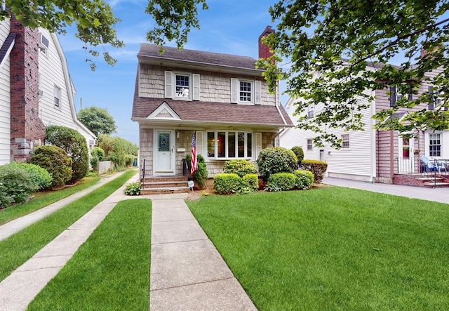 view of front of home with a front yard