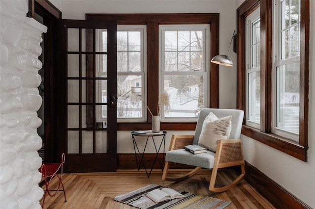 living area featuring parquet flooring