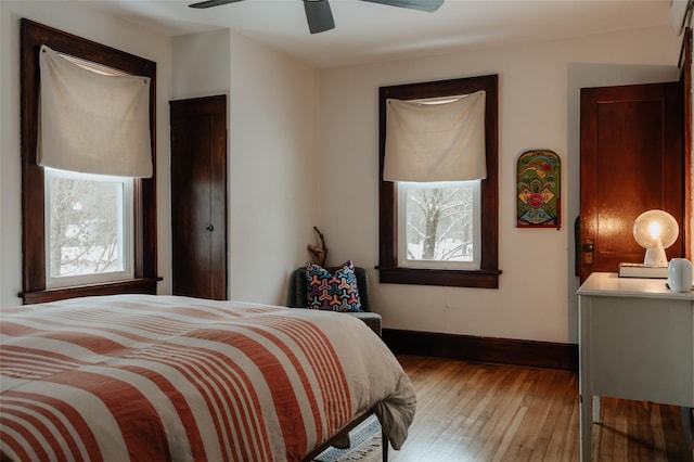 bedroom featuring ceiling fan and hardwood / wood-style flooring