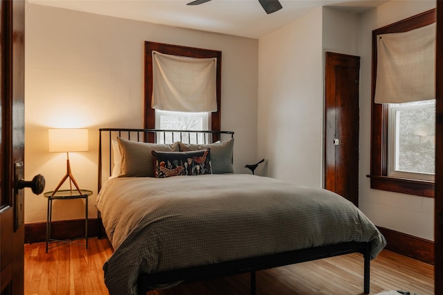 bedroom with ceiling fan and wood-type flooring