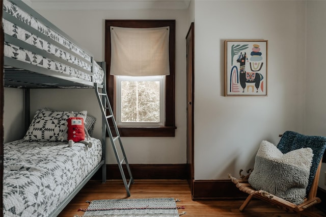 bedroom with hardwood / wood-style floors