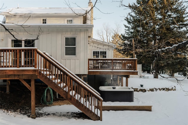 snow covered deck featuring central air condition unit