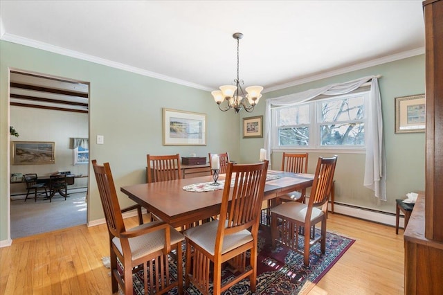 dining space featuring an inviting chandelier, light hardwood / wood-style flooring, a baseboard heating unit, and ornamental molding