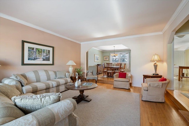 living room featuring hardwood / wood-style floors and crown molding