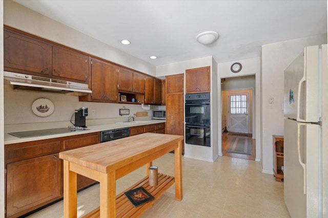 kitchen featuring black appliances and sink